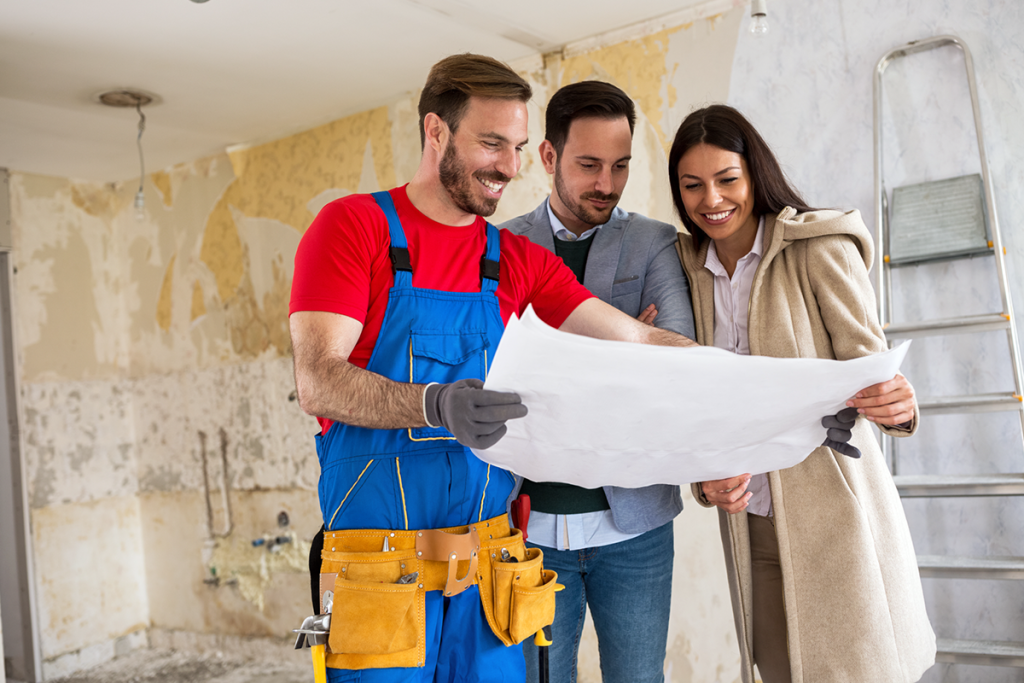 Construction Contractor Reviewing Plans with Clients