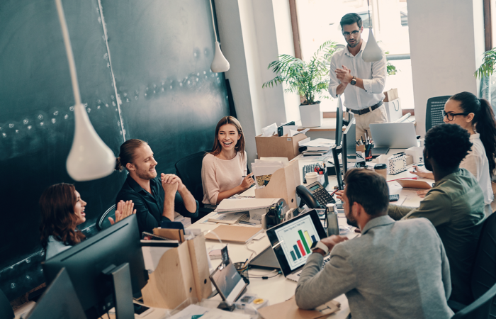 Midsize Business Sales Team Discussing Strategy